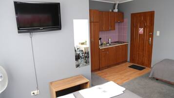Triple Room | Living area | Flat-screen TV