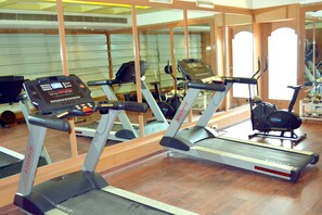 A gym with treadmills and exercise equipment.