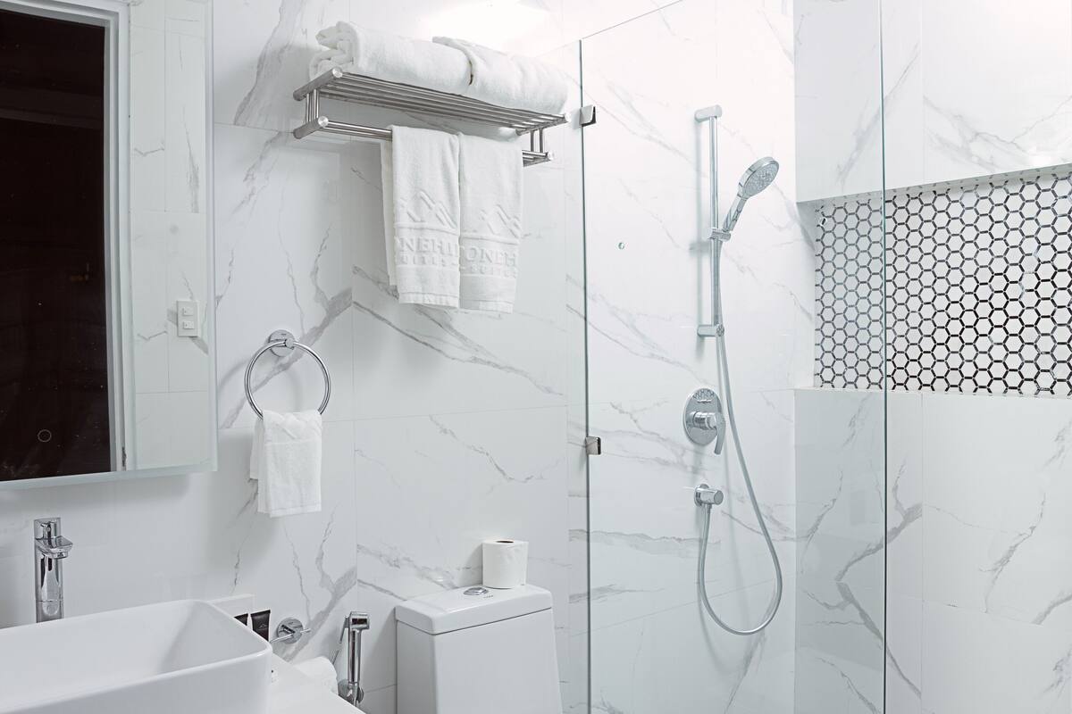 hair dryer, bathrobes, slippers, bidet