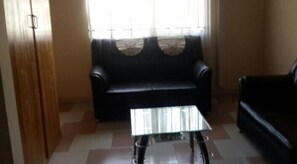 Suite | Zona de estar | Una televisión de pantalla plana