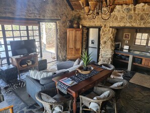 Luxury Cottage, Multiple Beds, Mountain View | Living area | Fireplace - Dawsons Game and Trout Lodge (Barberton)