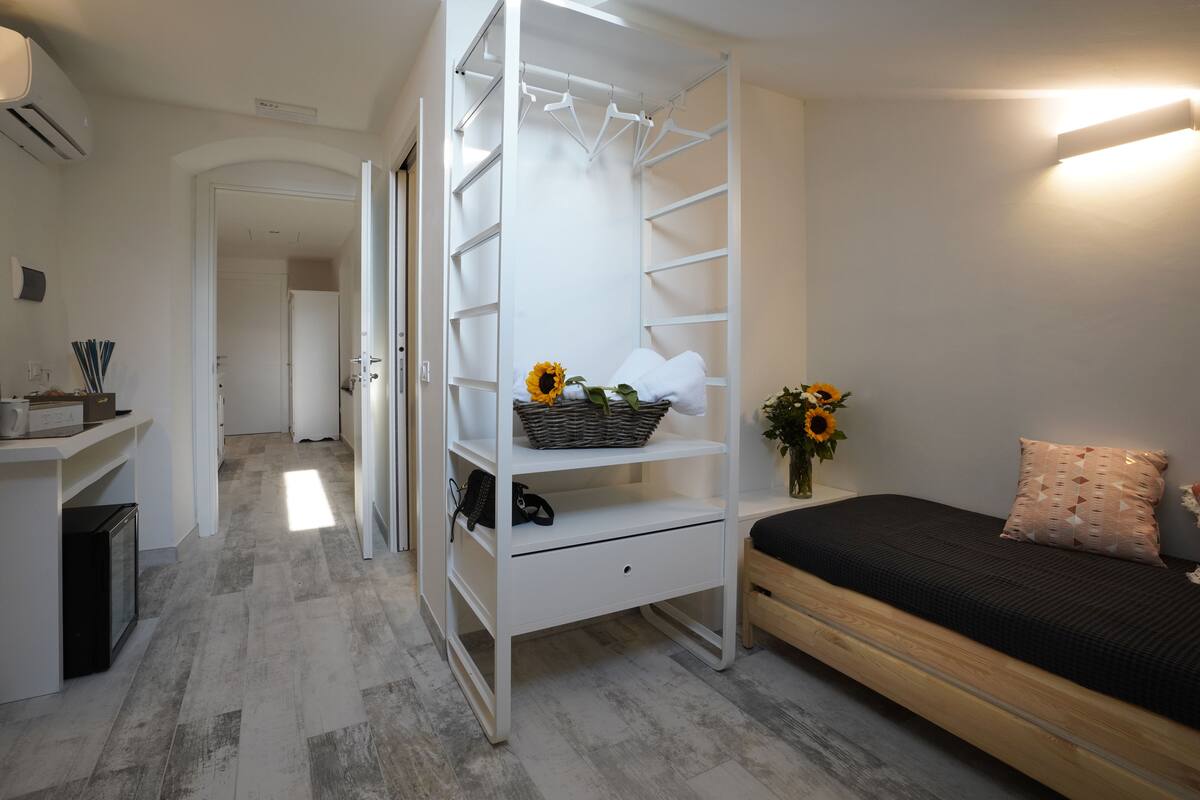 Single Room | Minibar, desk, cribs (free), WiFi (free)