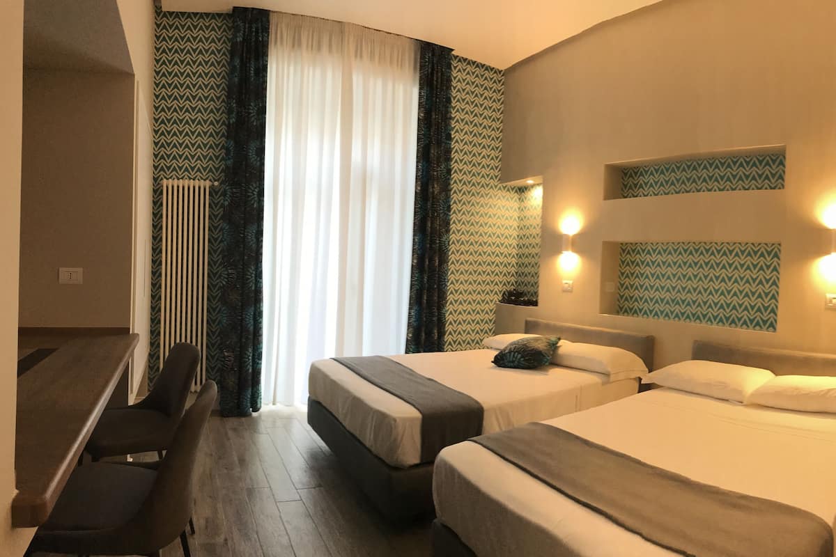 Quadruple Room | Minibar, desk, WiFi (free), individually furnished