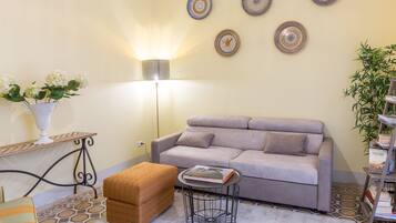 Apartment, 4 Bedrooms | Living room | Flat-screen TV