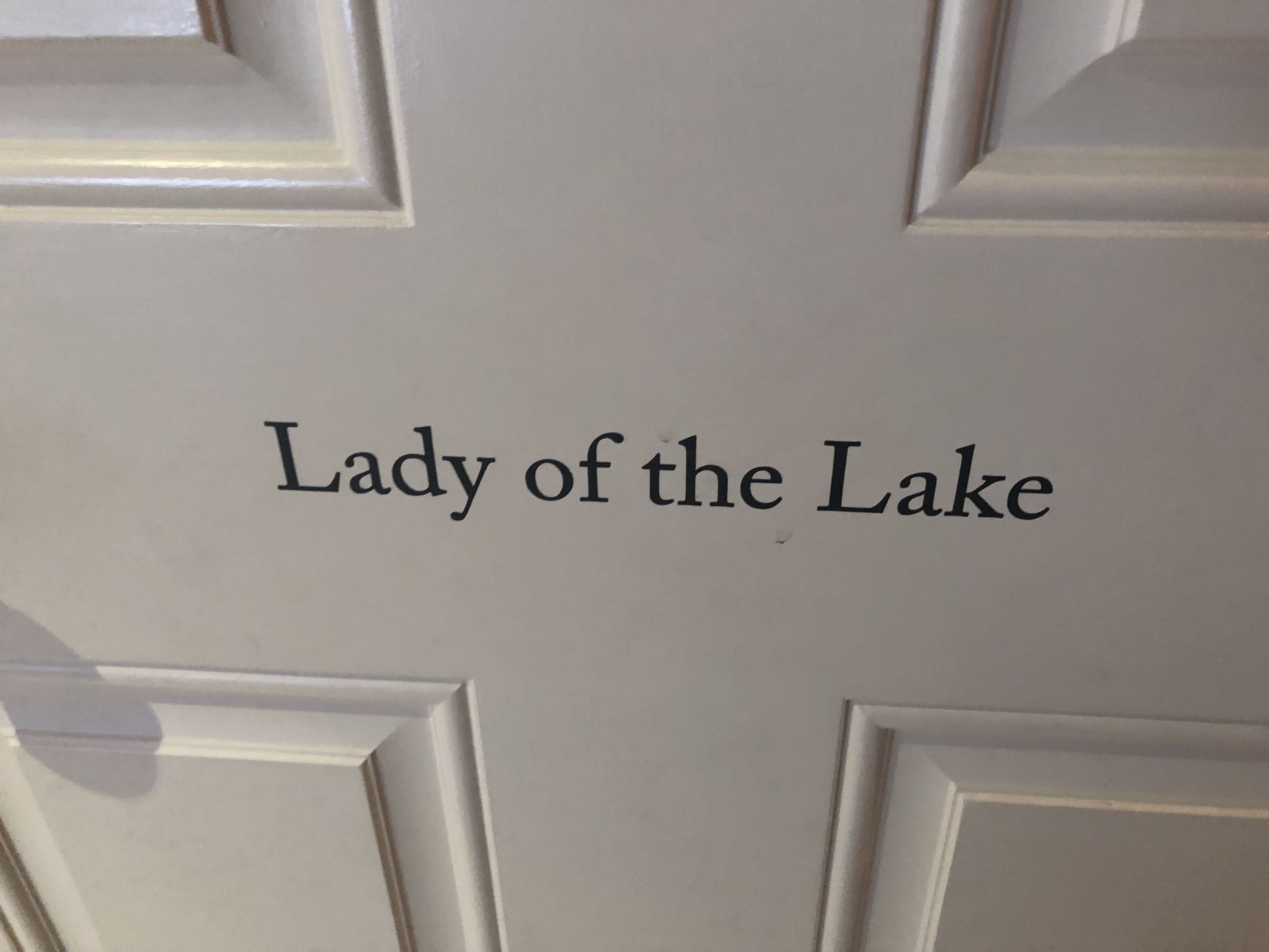 A door with the text "Lady of the Lake" on it.