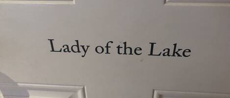 A door with the text "Lady of the Lake" on it.