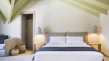 A bedroom with a wooden bed, two bedside lamps, a nightstand, a woven basket, and a door leading to another room.