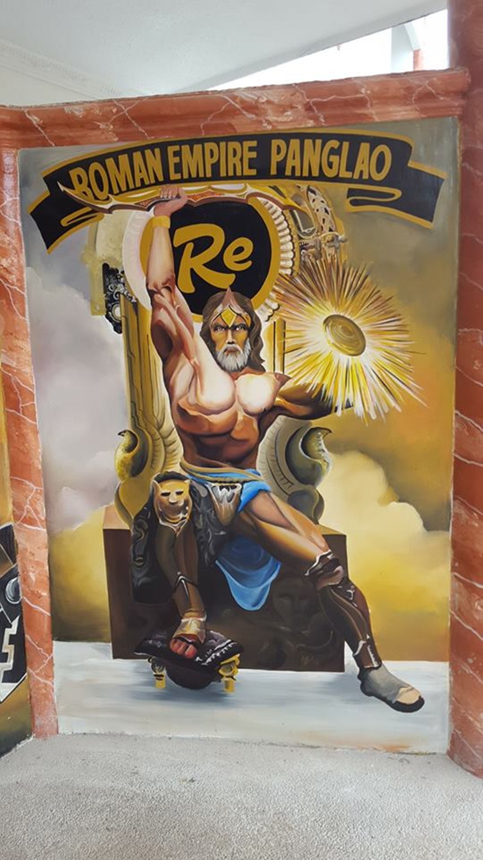 A mural of a muscular figure in Roman attire, with a sunburst and the text "Roman Empire Panglao" above.