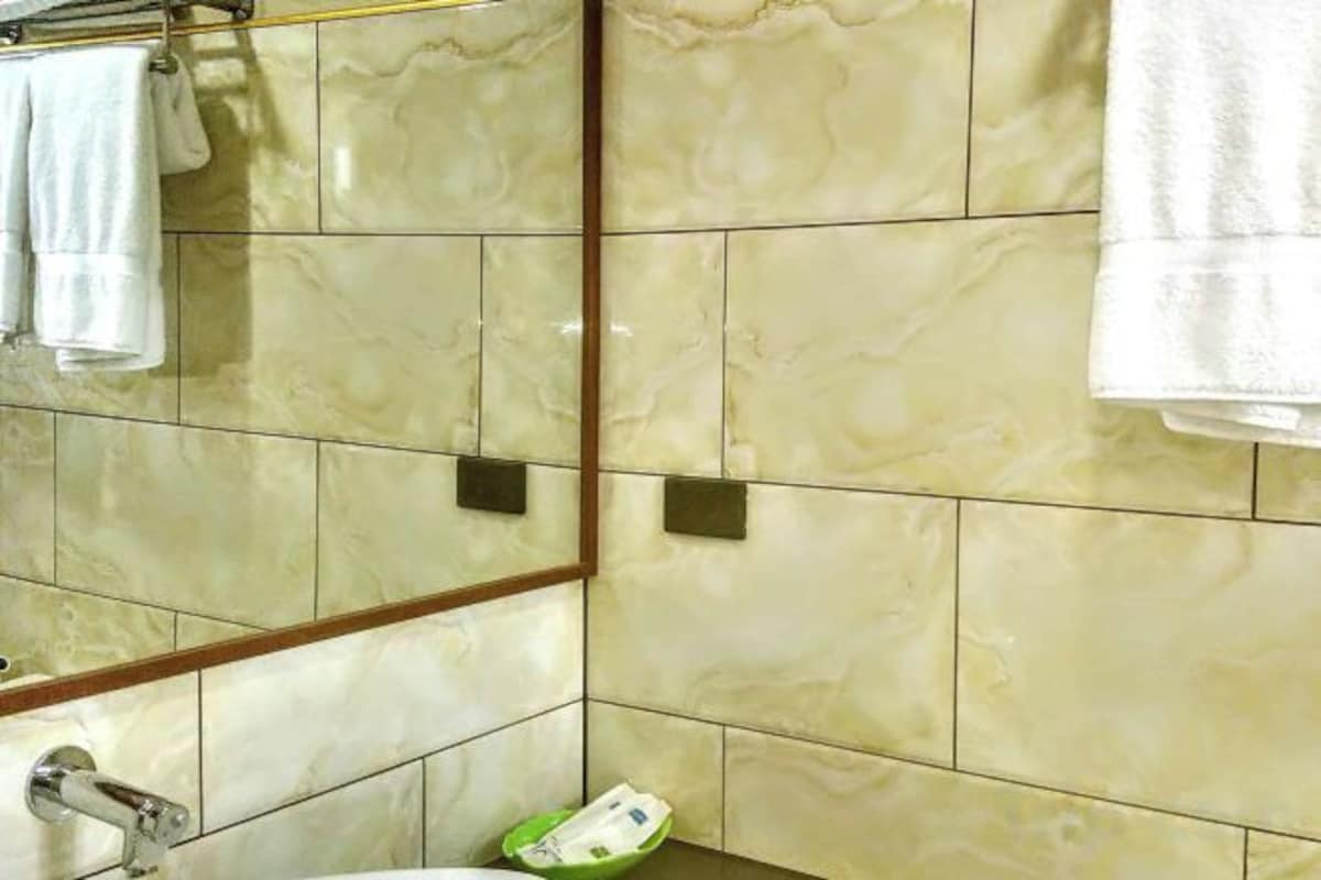 Bathroom | Shower, free toiletries, bathrobes, towels