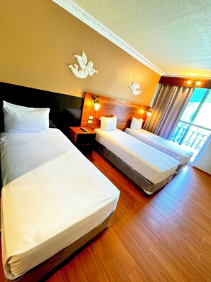 Family Triple Room, Multiple Beds, Non Smoking, Pool View | 1 bedroom, memory-foam beds, in-room safe, blackout curtains