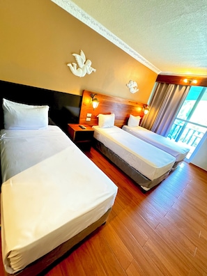 Family Triple Room, Multiple Beds, Non Smoking, Pool View | 1 bedroom, memory-foam beds, in-room safe, blackout curtains
