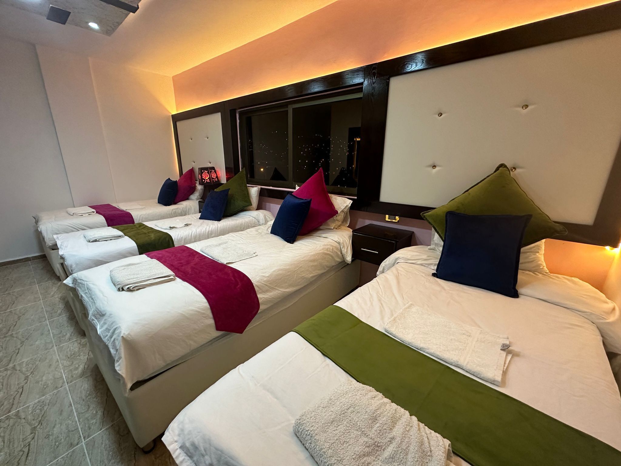 deluxe quadruple room | 1 bedroom, in-room safe, blackout curtains, iron/ironing board