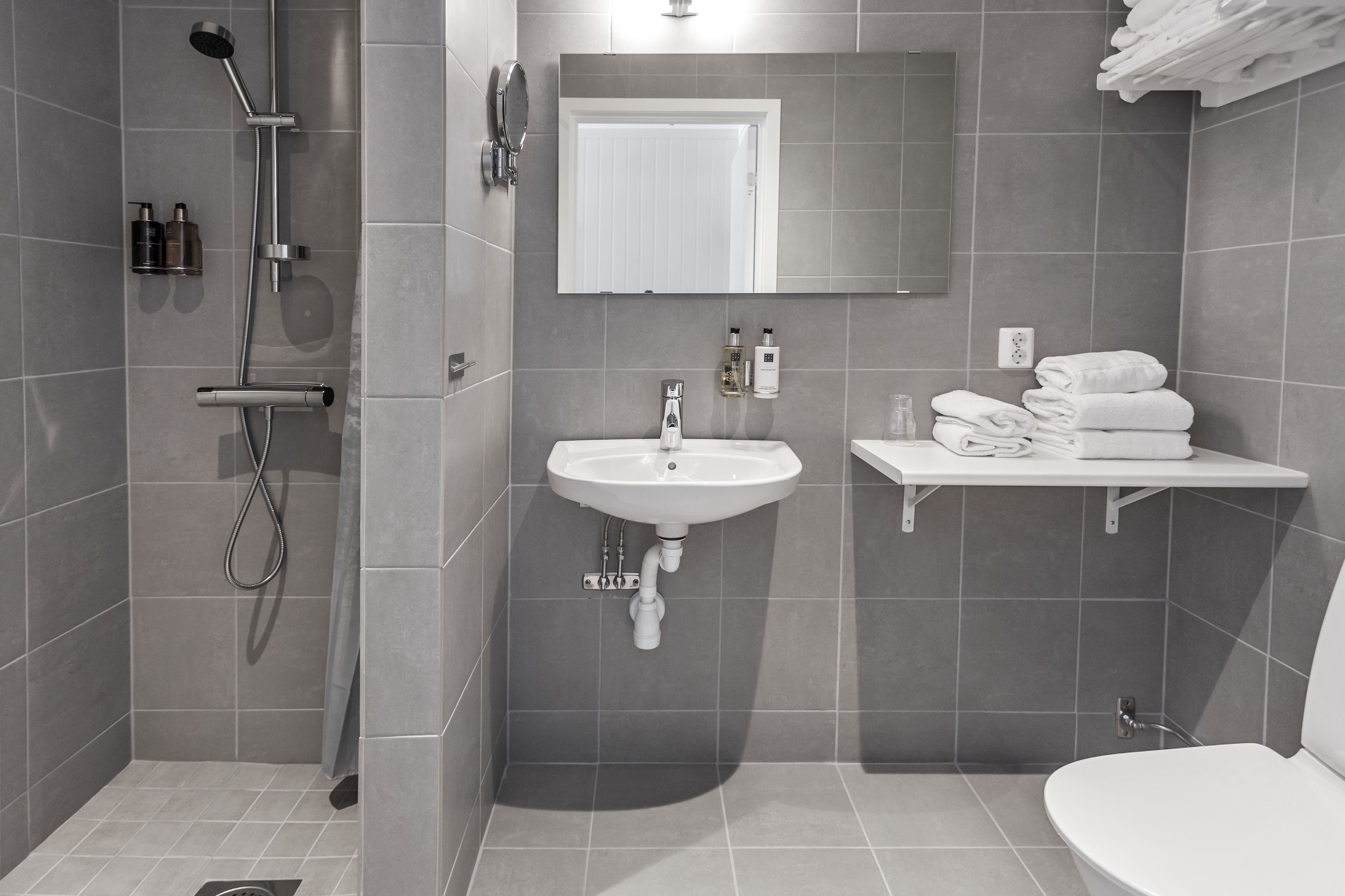 deluxe room | bathroom | designer toiletries, hair dryer, towels