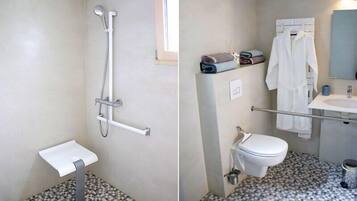 Un baño con ducha, inodoro y lavamanos.