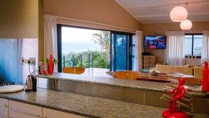 Executive Suite, 2 Bedrooms, Non Smoking, Sea View (Topaz) | Living area | 52-inch plasma TV with cable channels, TV