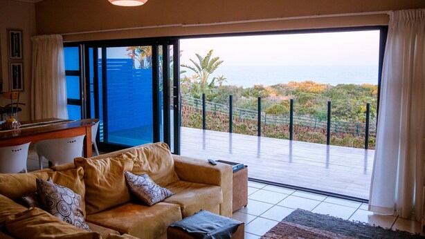 Executive Suite, 2 Bedrooms, Non Smoking, Sea View (Topaz) | Living area | 52-inch plasma TV with cable channels, TV