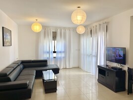 Family Apartment, 3 Bedrooms, Sea View | Living area | Flat-screen TV