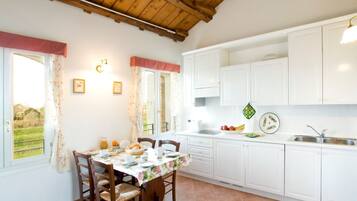 Apartment, 2 Bedrooms, 2 Bathrooms, Garden View (Livenza ) | Private kitchen | Fridge, stovetop, dishwasher, coffee/tea maker