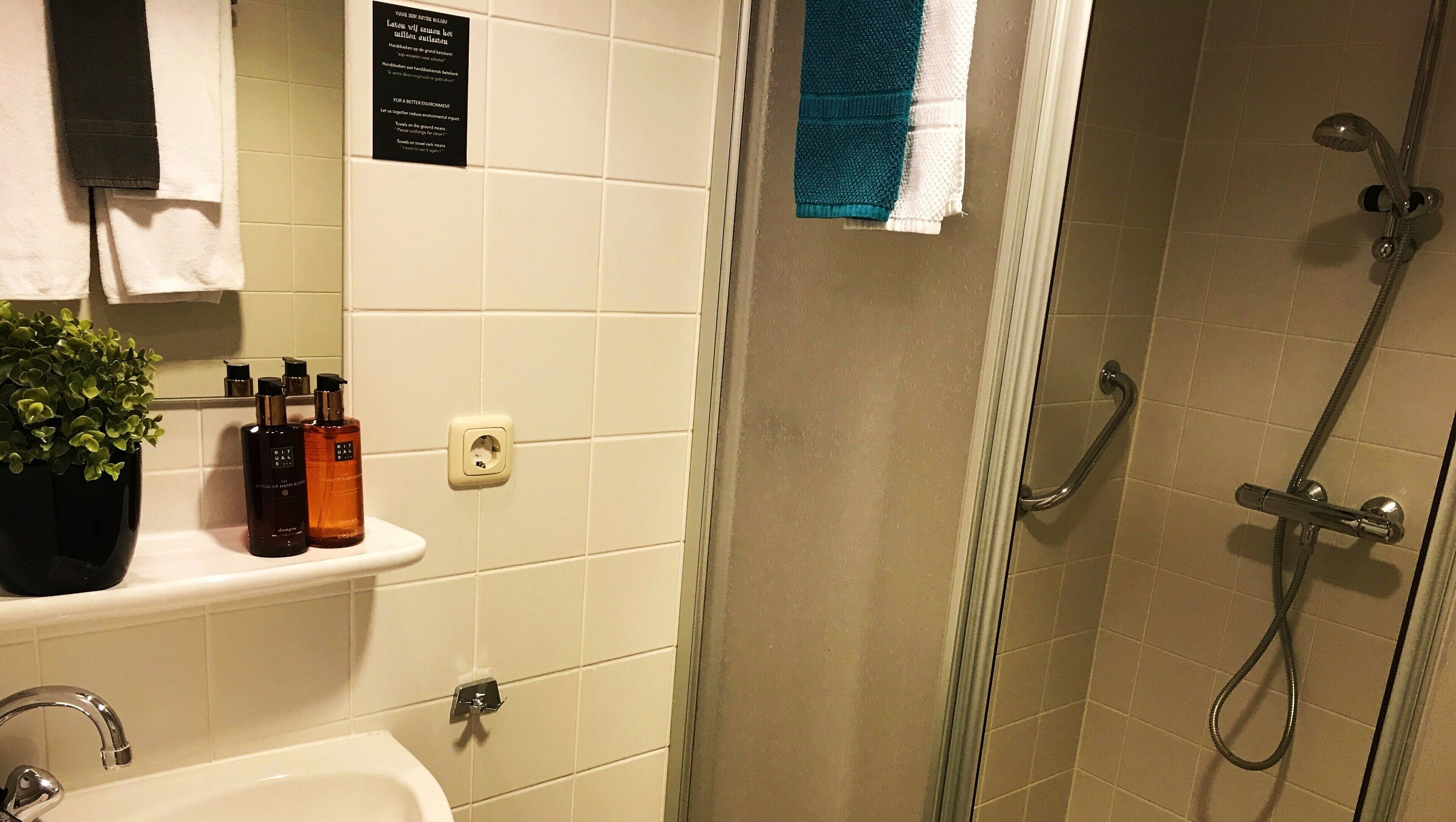 shower, designer toiletries, hair dryer, towels