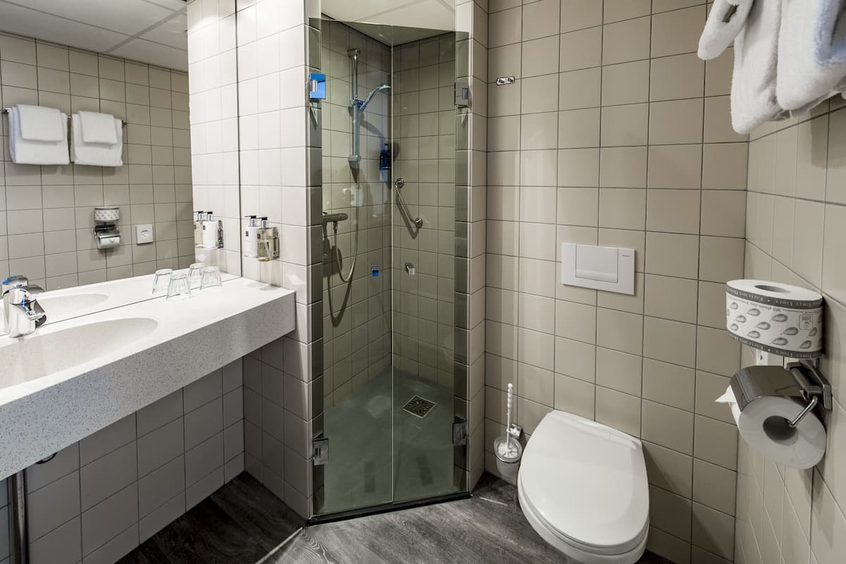 premium twin room | bathroom | shower, designer toiletries, hair dryer, towels