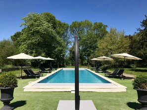 Outdoor pool, open 8:30 AM to 8:30 PM, pool umbrellas, pool loungers