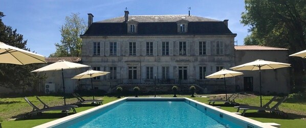 Outdoor pool, open 8:30 AM to 8:30 PM, pool umbrellas, pool loungers