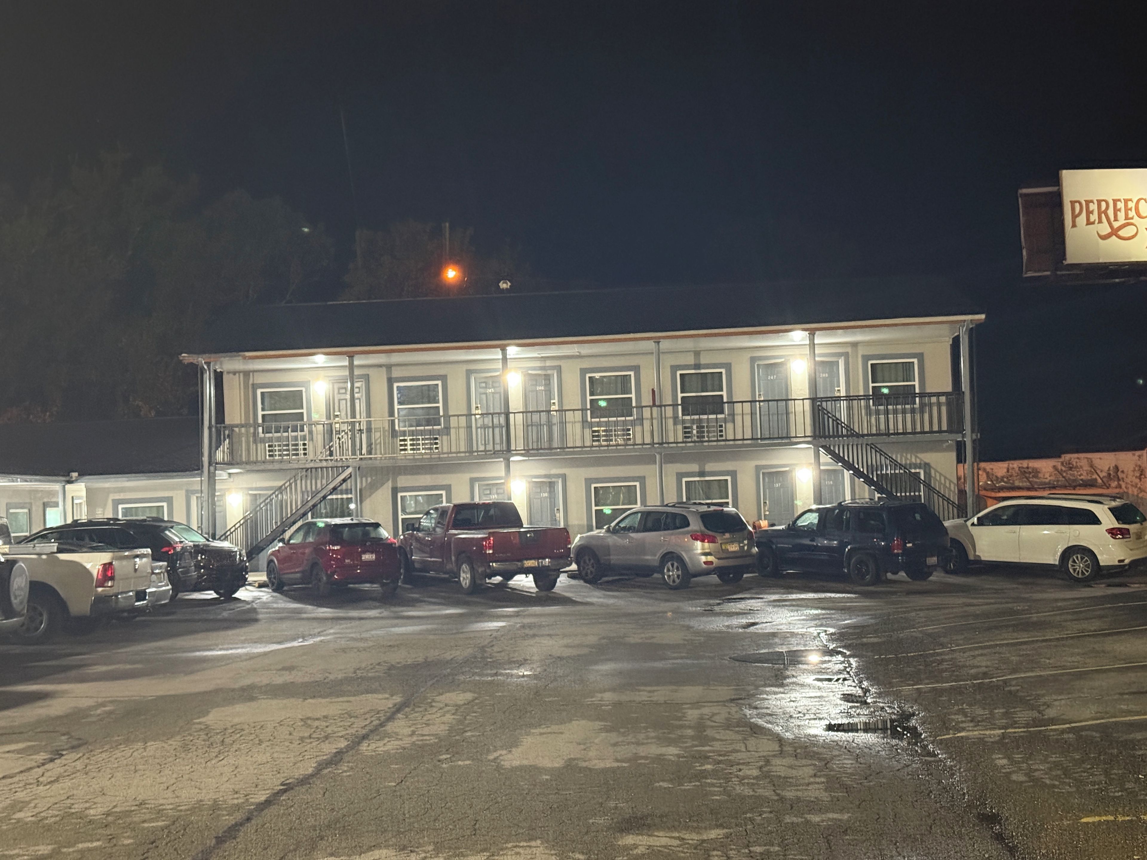 A multi-story building with a parking lot.