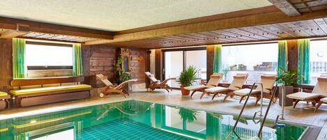 Indoor pool, open 8:00 AM to 9:00 PM, pool loungers