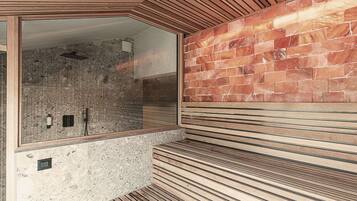 A modern bathroom with a stone wall, wooden slats, and a large mirror.