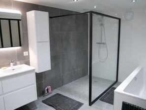 Bathtub, hair dryer, towels, soap