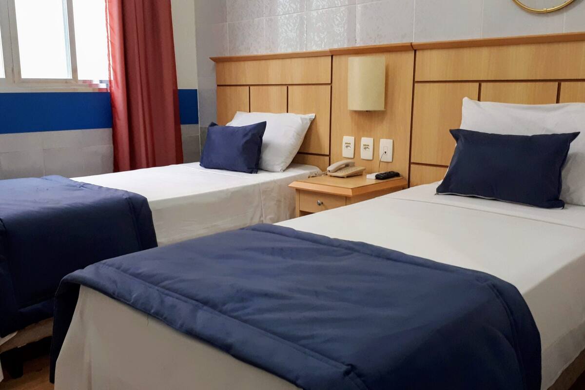 Twin Room, Non Smoking | Minibar, blackout curtains, iron/ironing board, free WiFi