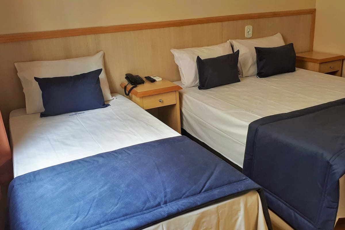Triple Room, Multiple Beds, Non Smoking | Minibar, blackout curtains, iron/ironing board, free WiFi