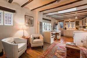 TV, fireplace, books - Sunny Adobe Retreat Steps from Historic Downtown (Santa Fe)
