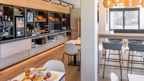 A modern breakfast bar with a variety of food options and a seating area with bar stools. - B&B HOTEL Hannover-Laatzen (Laatzen)