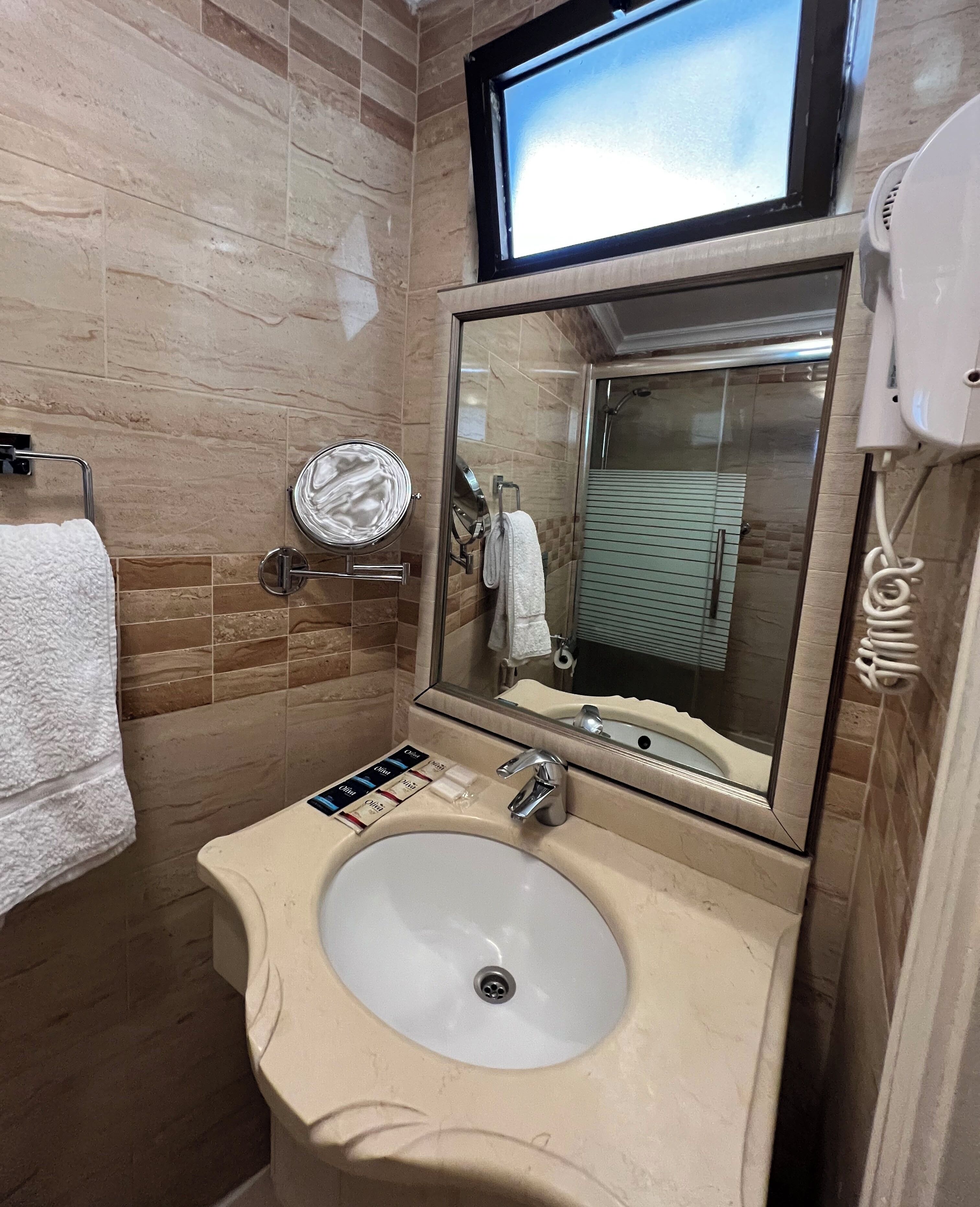 honeymoon room, 1 queen bed | bathroom | rainfall showerhead, free toiletries, hair dryer, slippers