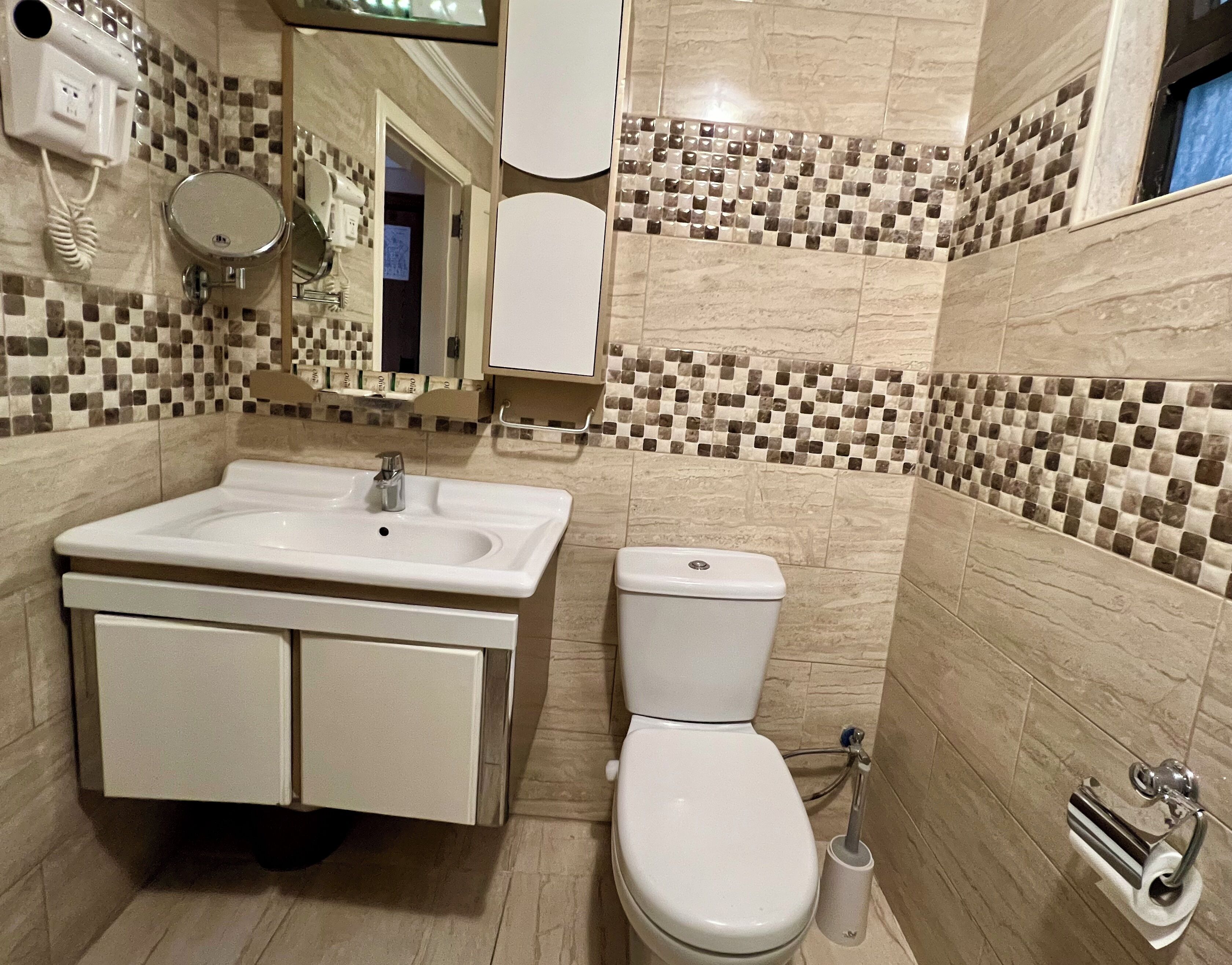 quadruple room | bathroom | rainfall showerhead, free toiletries, hair dryer, slippers