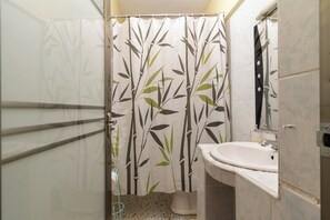 Family Apartment, 1 Bedroom | Bathroom | Shower, free toiletries, hair dryer, slippers