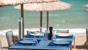 On the beach, sun-loungers, beach umbrellas, beach towels