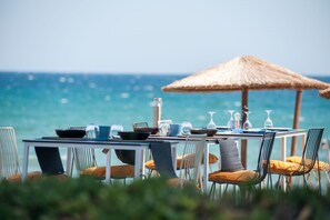 On the beach, sun-loungers, beach umbrellas, beach towels
