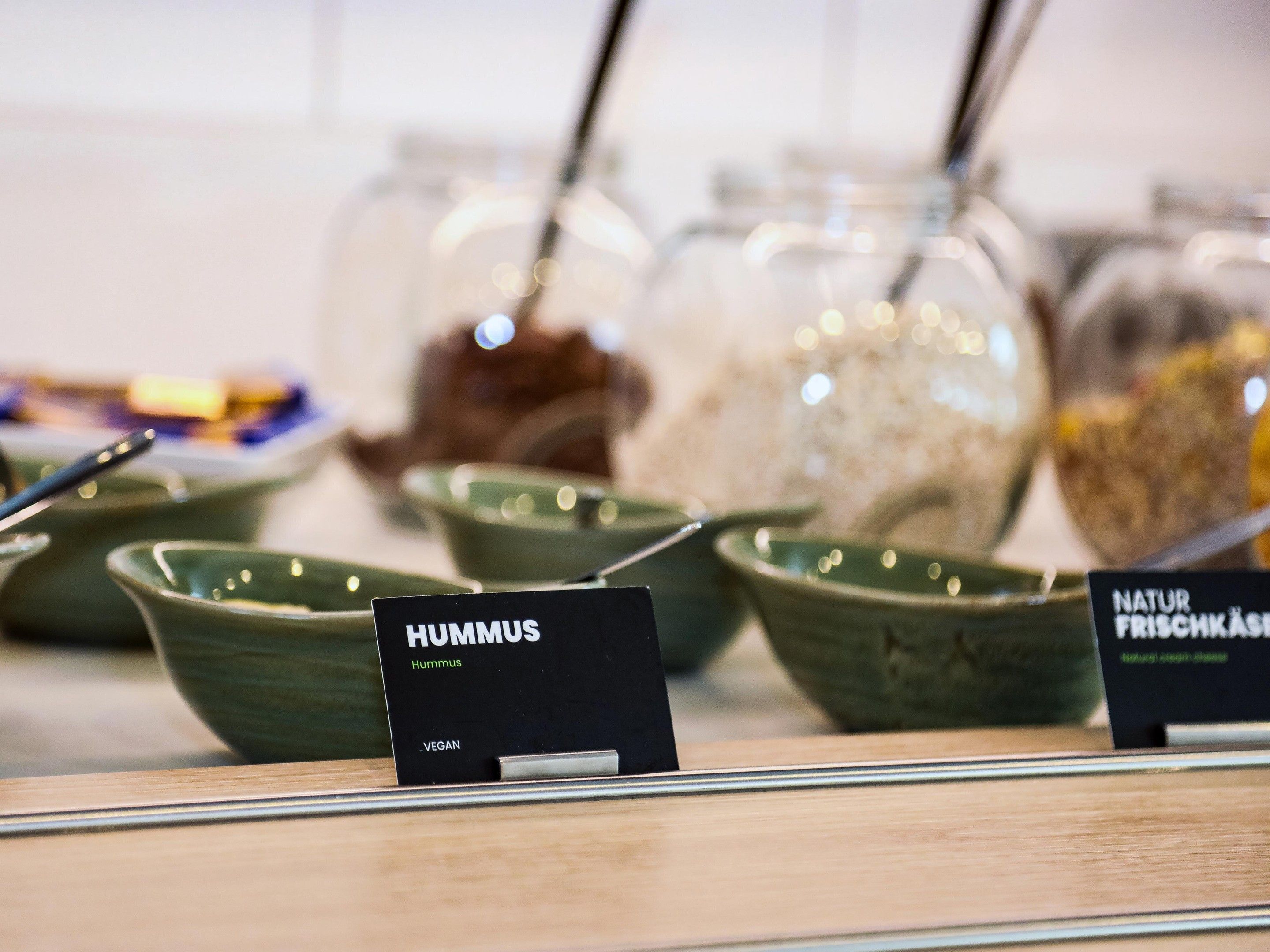 A display of food items with labels indicating vegan options.