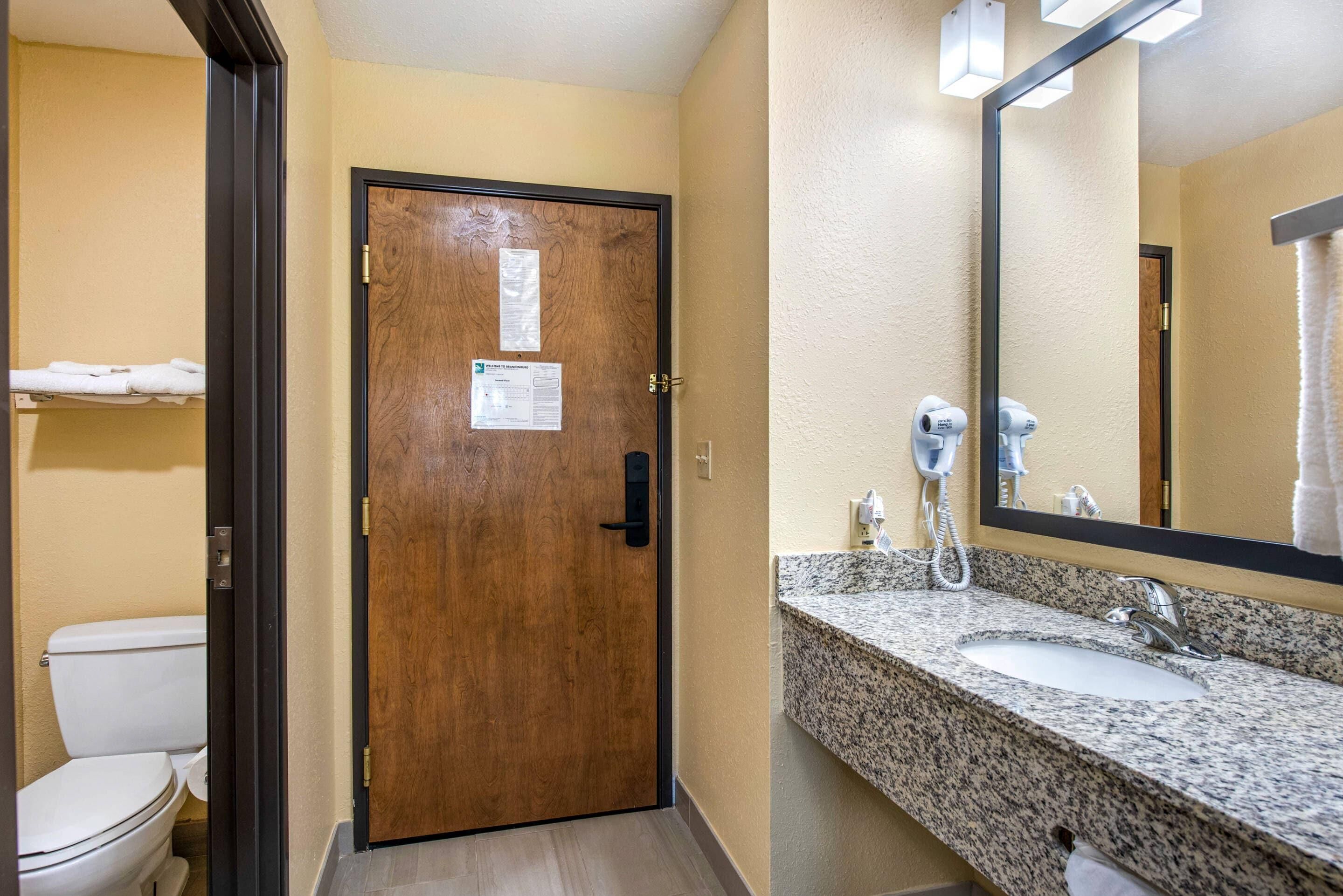 hypo-allergenic bedding, desk, laptop workspace, blackout curtains