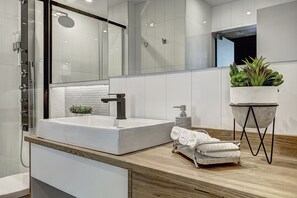 Shower, rainfall showerhead, hair dryer, towels