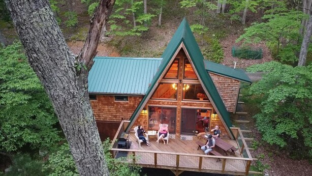 A cabin with a triangular roof and a deck area. - A-Frame Cabin Escape in George Washington Natl Forest, Lost River Area, WV (Wardensville)