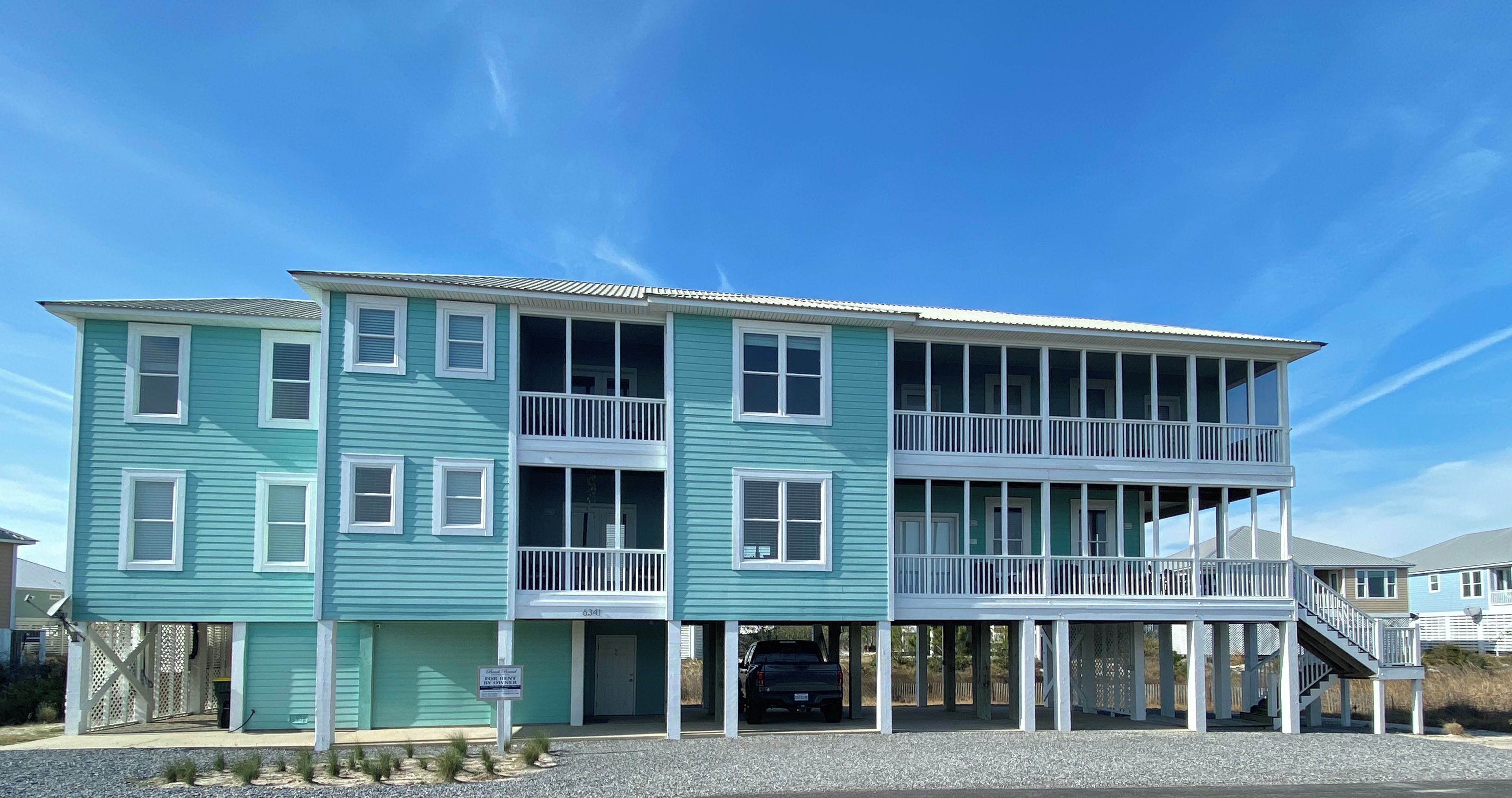 A two-story family home with a balcony and a garage.