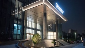 A modern hotel entrance with a glass facade, a covered outdoor area, and a sign indicating it is a Marriott hotel. - Grand Skylight International Hotel Haoyue Shenzhen (Shenzhen)
