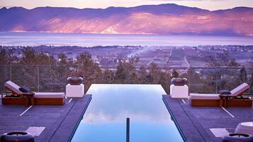 Outdoor pool, open 7:00 AM to 10:00 PM, pool umbrellas