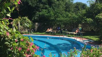 Outdoor pool, open 6:00 AM to 6:00 PM, pool umbrellas, pool loungers