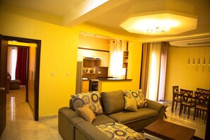42-inch flat-screen TV with cable channels, TV - Victoria Blue Hotels & Apartments (Kigali)