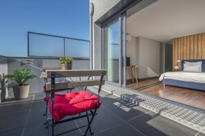 Loft panorâmico, vista para a cidade | Terraço/pátio