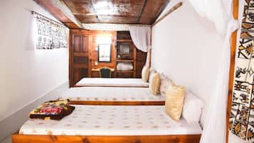 Triple Room | Desk, blackout drapes, iron/ironing board, cribs/infant beds